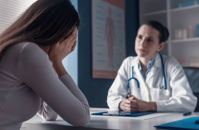 Depressed woman is visiting a doctor 