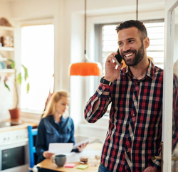 Sober man talks on a phone at home after rehab