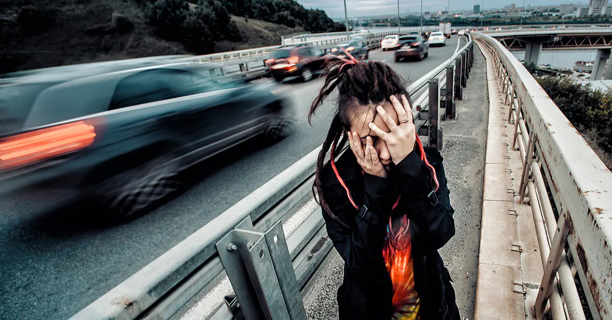 Woman in front of freeway