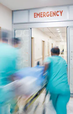 Doctors with patient on a gurny