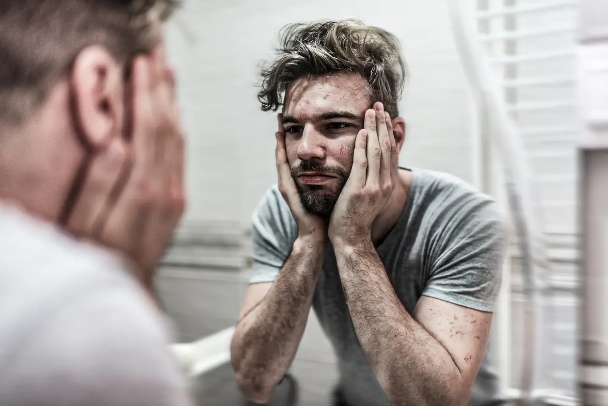 Man looking in mirror