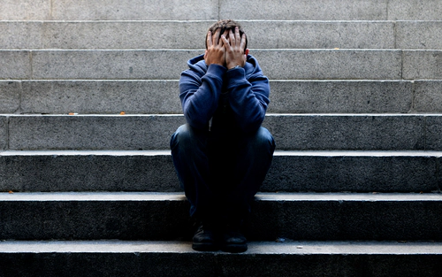 Man crying on steps